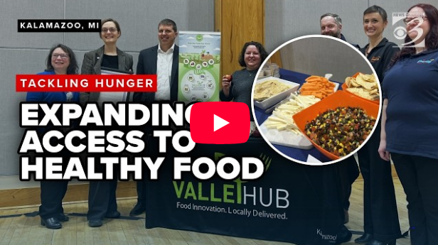 Screenshot of cover photo for WMMT news segment on Expanding Access to Healthy Food. Image shows local food systems leaders posing by a ValleyHub table.