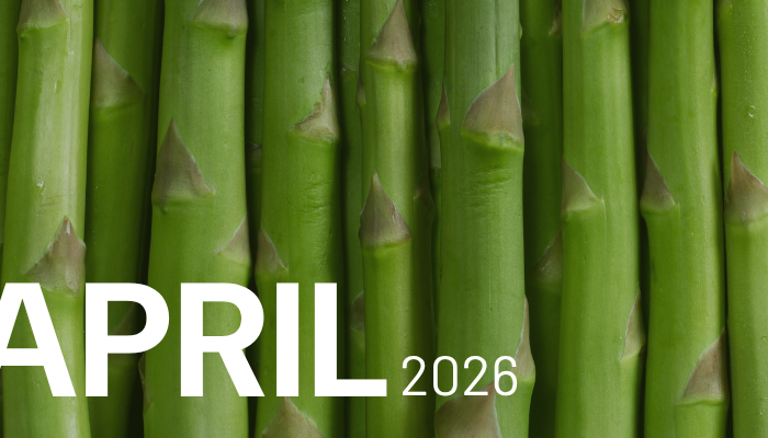 Closeup of stalks of asparagus. Text reads: April 2026