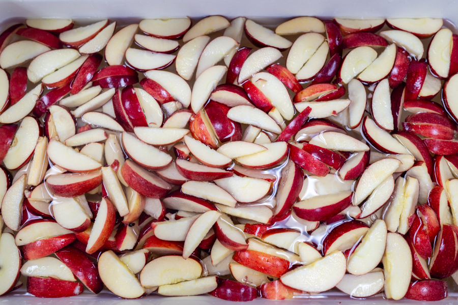 Apple slices being washed at Flint Fresh